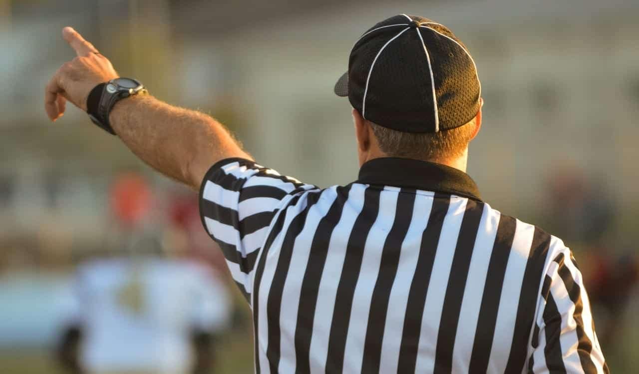 back of referee pointing