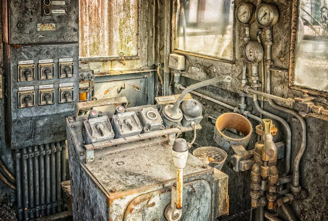 rusted driver's cab and dashboard with levers and switches