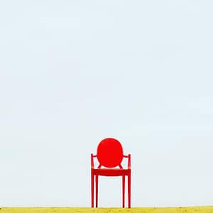 Red Armchair on Brown Surface